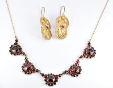 Victorian Bohemian cut garnet necklace, length 44.5cm and a pair of silver gilt filigree earrings