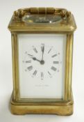 Brass carriage clock with Roman enamelled dial and Arabic minutes, marked Mappin & Webb, with