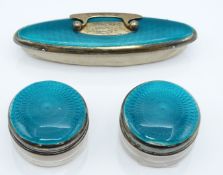George V pair of turquoise guilloché enamel and hallmarked silver dressing table pots and matching