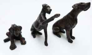 Three miniature bronze dogs or puppies, height of tallest 7.5cm