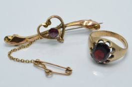 A 9ct gold ring and brooch set with garnets, 5g