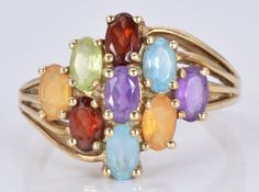A 9ct gold ring set with topaz, garnets, citrine, peridot and amethysts, 3.6g, size N/O