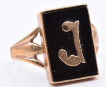 A 9ct gold ring set with onyx and a gold letter J, 3.8g, size T