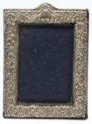 Hallmarked silver photograph frame to suit 6 x 4 inch photo, with embossed decoration and easel