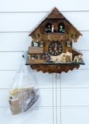 Black Forest cuckoo clock c1970 with three train weighted movement incorporating automaton musical