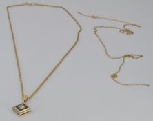 A 9ct gold pendant set with diamonds and sapphires with two 9ct gold chains, 4.5g
