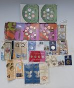 A quantity of coins in presentation packs to include £2, £1, pre-decimal, old penny sets, 50