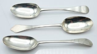 Three Queen Anne and Georgian bottom hallmarked silver table spoons, one a Britannia standard dog
