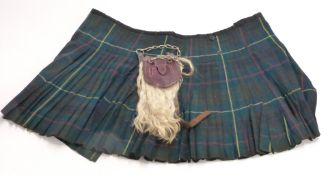 A children's kilt and sporran with white metal mounts