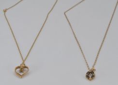 Two 9ct gold pendants on 9ct gold chains, 3.7g