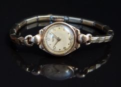 Rotary 9ct gold ladies wristwatch with gold hands and Arabic numerals, railroad minute track,