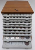 An amateur coin collection of 18thC and 19thC world coinage contained in a 1970s ten-tray lockable