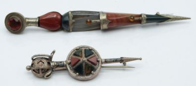 Two Scottish silver kilt pins/ brooches set with various agates in the form of daggers, 23.5g