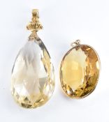 Two Edwardian pendants each set with a large citrine