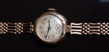 Tavannes Edwardian yellow metal ladies wristwatch with inset subsidiary seconds dial, blued hands,