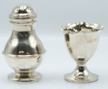Modern hallmarked silver pepper, London 1979 maker C J Vander Ltd, height 9cm, together with an