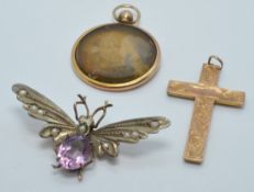A c1900 silver gilt pin in the form of a butterfly set with amethyst and seed pearls and a 9ct