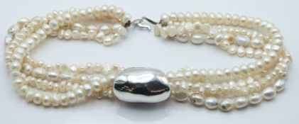 A four strand cultured pearl with large silver slider