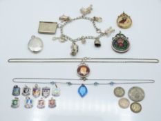 A silver charm bracelet with a stamp case charm, silver charms, a silver necklace by WBs etc. 99.