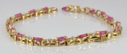 A 10k gold bracelet set with rubies and diamonds, 5.8g
