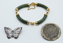A silver brooch in the form of a butterfly set with enamel by J A & S, nephrite jade bracelet and