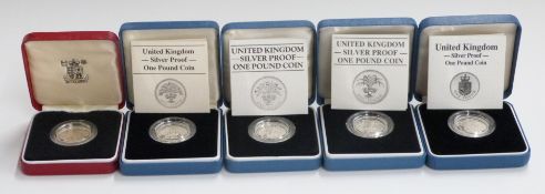 Five Royal Mint silver proof £1 coins, 1983, 1984, 1985, 1987 and 1988, all cased with certificates