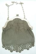 A shaped white mesh /silver mesh purse/bag with trailing daisy-style decoration marked 'Alpaca',