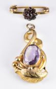 Victorian pendant set with an oval cut amethyst, 1.5 x 3.5cm and a 9ct gold brooch set with Bohemian