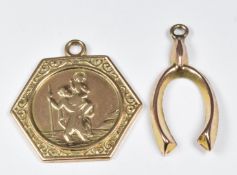 A 9ct gold St Christopher pendant and a 9ct gold wishbone charm/pendant, 2.3g