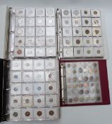 Four collector's albums containing a large collection of world coinage, mostly catalogued in