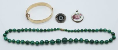 A silver and guilloché enamel pendant, silver brooch, rolled gold bangle and malachite necklace (