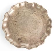 Carrington & Co. George V hallmarked silver card tray or small salver, with shaped edge and raised
