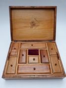 A 20thC continental sewing / needlework inlaid workbox with inlaid decoration to lid and fitted lift