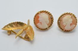 A pair of 9ct gold earrings set with a cameo to each (3.6g) and a yellow metal brooch (1.8g)