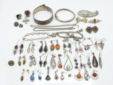 A collection of silver jewellery including silver bangle, silver rings, silver earrings etc, 213g