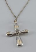An 18ct white gold cross pendant set with a diamond, 2g