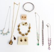 A collection of vintage necklaces and tiger's eye