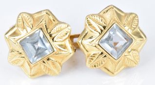 A pair of 18ct gold earrings set with aquamarines, 2.7g