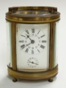 Oval cased brass carriage clock with Roman and Arabic enamelled dial marked Deutsch, J Faubourg,