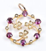 Edwardian 9ct gold pendant set with seed pearls and garnets, 1.6g