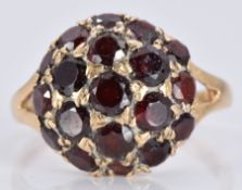 A 9ct gold ring set with garnets, 3.6g, size O