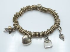 Links of London silver charm bracelet in original box, 70g