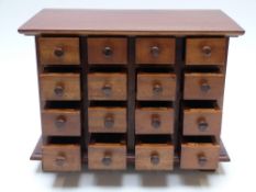 A hardwood miniature collector's chest of 16 drawers, W35 x D20 x H26cm