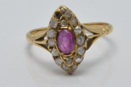 Victorian ring set with an oval cut pink sapphire surrounded by diamonds in a marquise shaped