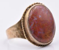 A yellow metal ring set with agate, size W