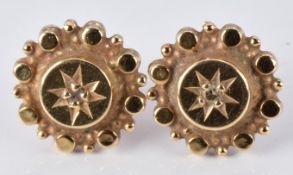 A pair of Victorian earrings set with a diamond to the centre, 1.5g