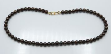 A beaded boulder opal necklace