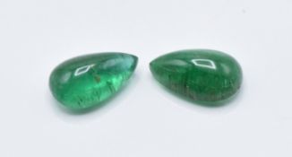 A pair of loose pear cut emeralds measuring 4.25ct each