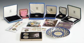 A collection of various silver proof and cupro-nickel commemorative coins, to include TT Winner