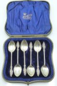 Edward VII cased set of six hallmarked silver teaspoons with Art Nouveau foliate finials, Birmingham